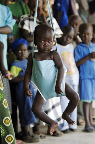 A young child being weighed at a health centre in Juba, Southern Sudan