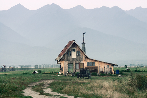 Traditional House in Front of the Fagaras Mountains, Romania