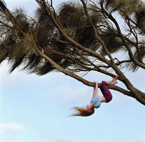 Girl Hanging From Tree