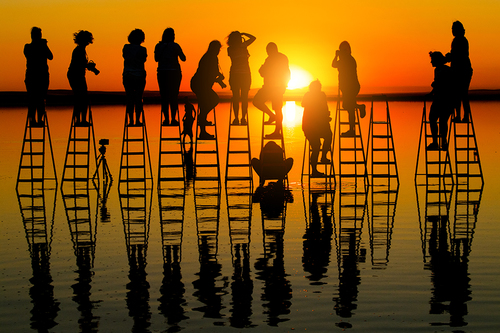 dancer taking photo at sunset