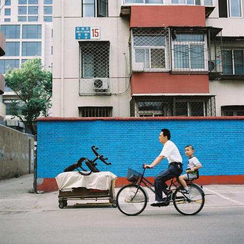 Father and Son against Blue Wall