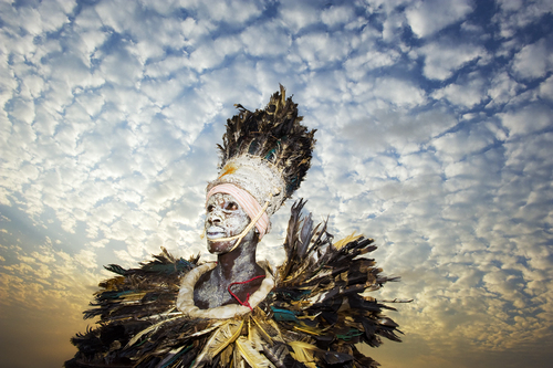 West African tribal dancer waiting to perform 