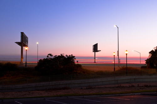 Empty Billboards over a Parking Lot