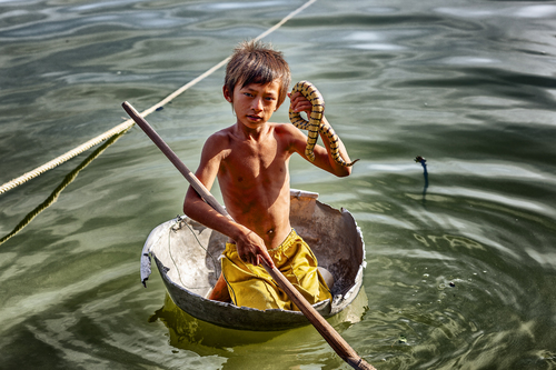 Young entrepreneur, Lake Tonle Sap, Cambodia
