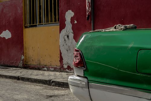 the green car in a red wall