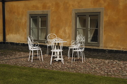 White Chairs on Cobblestones