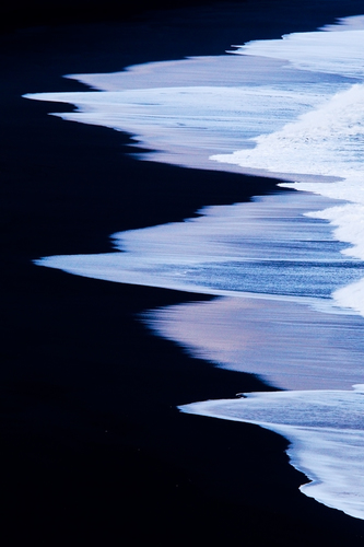 Waves on lava beach