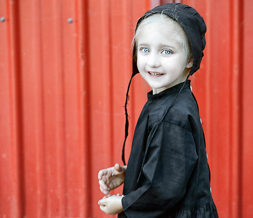 Old Order Amish Girl at Barn