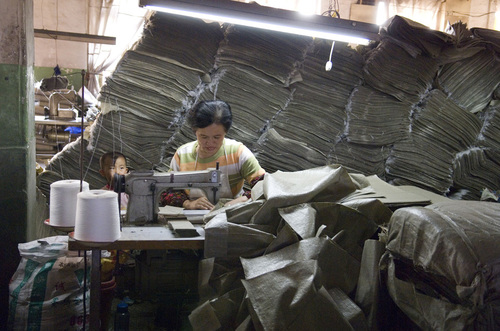chinese_sewing_worker_with_child
