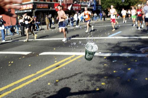 Dropping a cup at a water station in NY marathon 