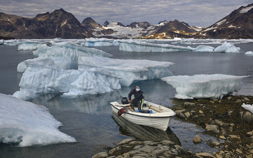 One-armed Inuit Man Coming Back After Seal Hunt One-armed Inuit Man Coming Back After Seal Hunt