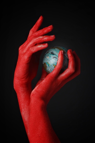 Red hands blue globe