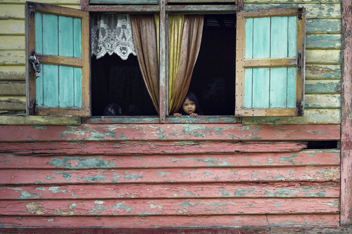 Little Girl At Her Traditional Malay House