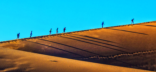 Climbing the dune at sunrise