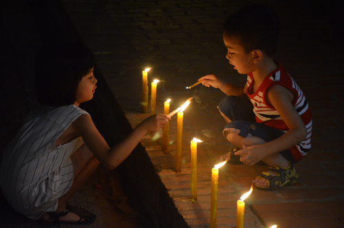 Children Lighting Candles, Awk Phansa, Luang Prabang, Laos