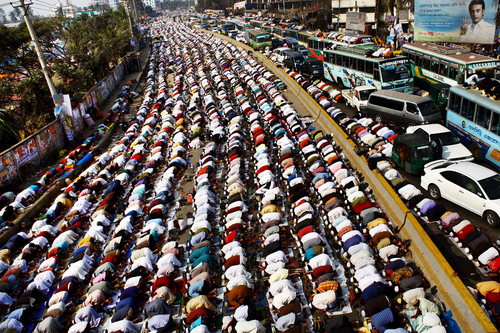 Devotees praying on the road 