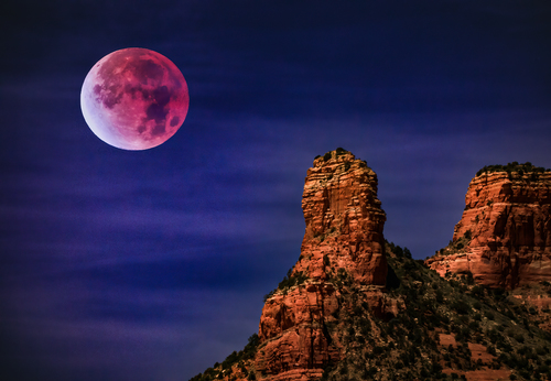 Red moon over the red rocks