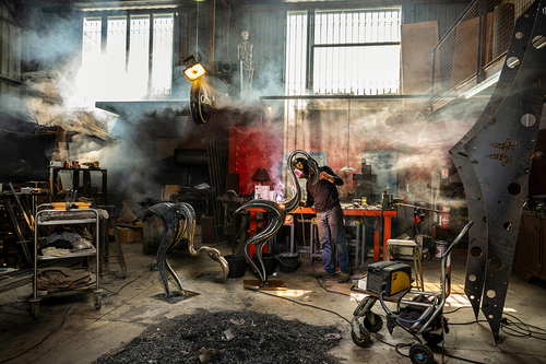 Iron worker in his workshop