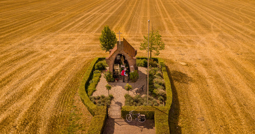Chapel with Old Man in the Middle of Grain Field