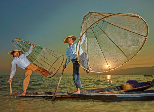 Fisher at sunset on Inle Lake