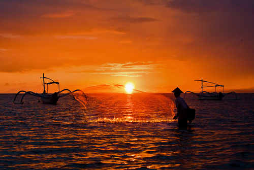 Fisherman in sunset